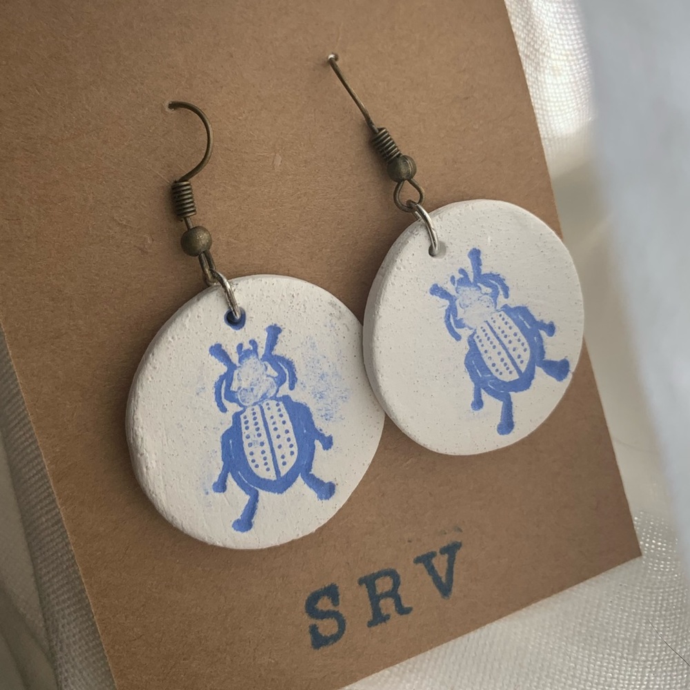 natural stoneware handmade blue stamped beetle earrings